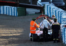 Force India's VJM05 is recovered from the barriers after Jules Bianchi went off on Thursday morning