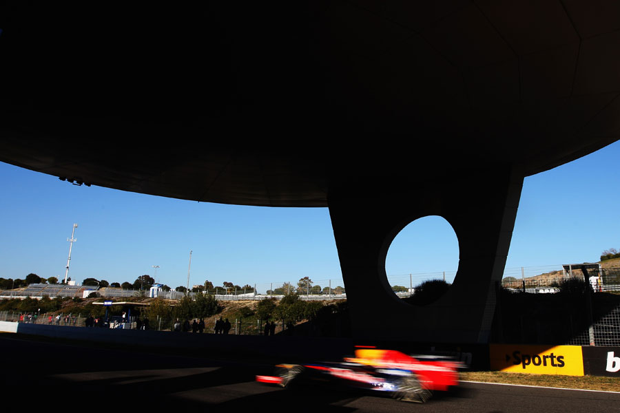 Sebastian Vettel speeds under the media centre at Jerez
