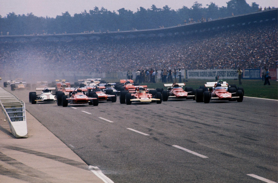 Jochen Rindt and Jacky Ickx lead the pack away from the grid