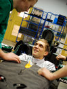 Vitaly Petrov carries out a seat fitting at Caterham