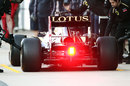 Romain Grosjean pits his Lotus after chassis problems