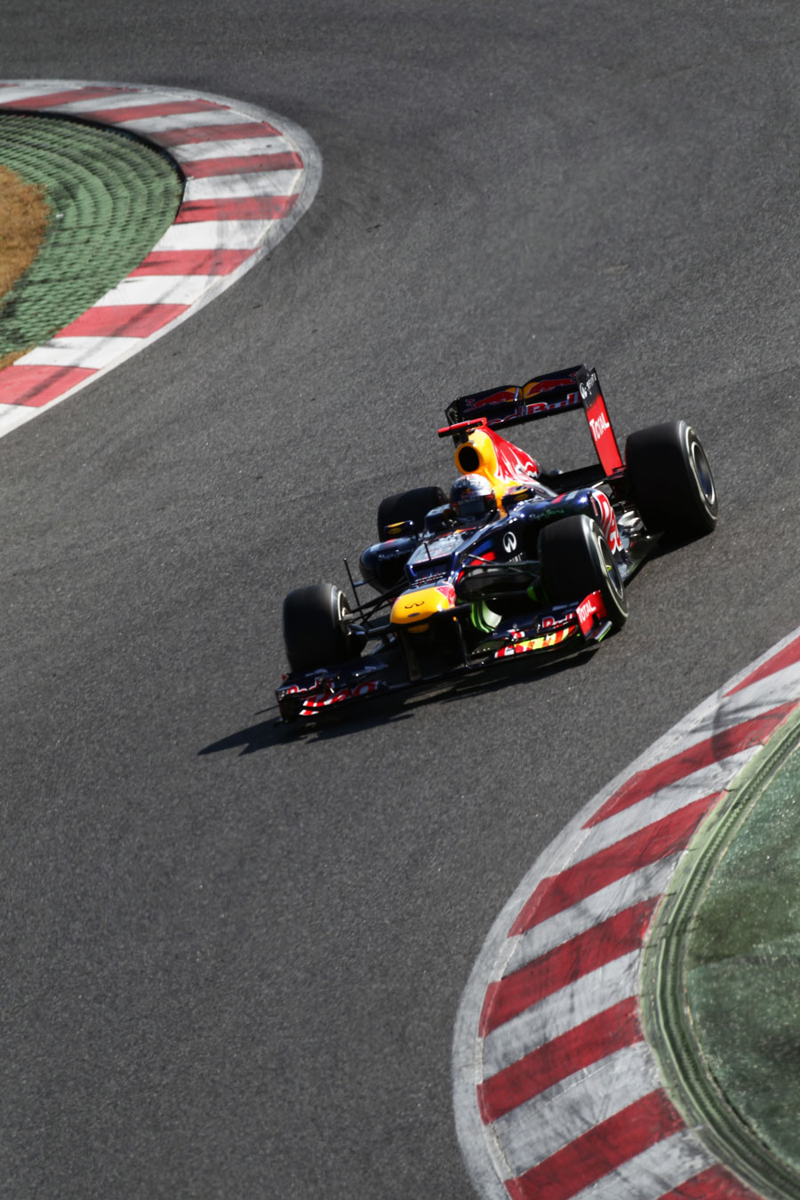 Sebastian Vettel tackles the high-speed turns one and two