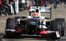 Sergio Perez leaves the Sauber pit box