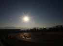 Cars head out for installation laps as the sun rises over the third day in Barcelona