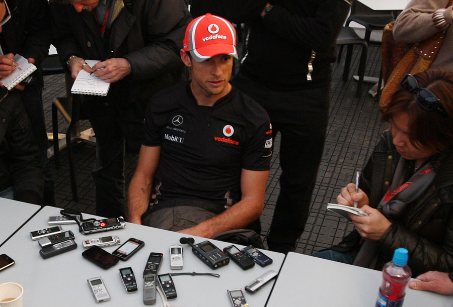 Jenson Button talks to the press after a day's testing