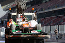 Paul di Resta's Force India is returned to the pits after his off at turn 9