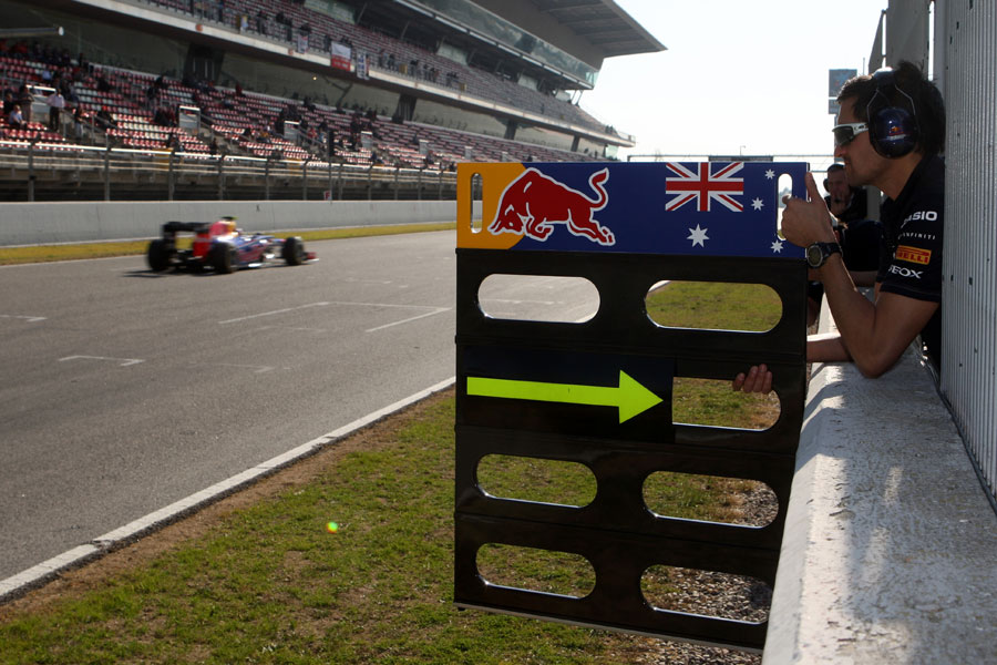 Mark Webber is instructed to come in at the end of the lap by his pit board