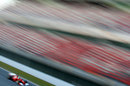 Felipe Massa speeds past the main grandstand at the Circuit de Catalunya