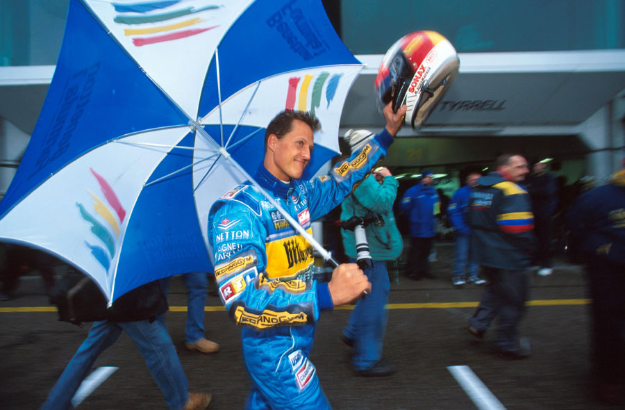 Michael Schumacher salutes the fans after all but sealing his second championship