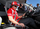 Fernando Alonso familiarises himself with the controls of a Ferrari 458 road car