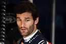 Mark Webber talks to his mechanics in the Red Bull garage