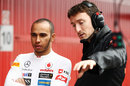 Lewis Hamilton talks to McLaren's Andy Latham in the pit lane