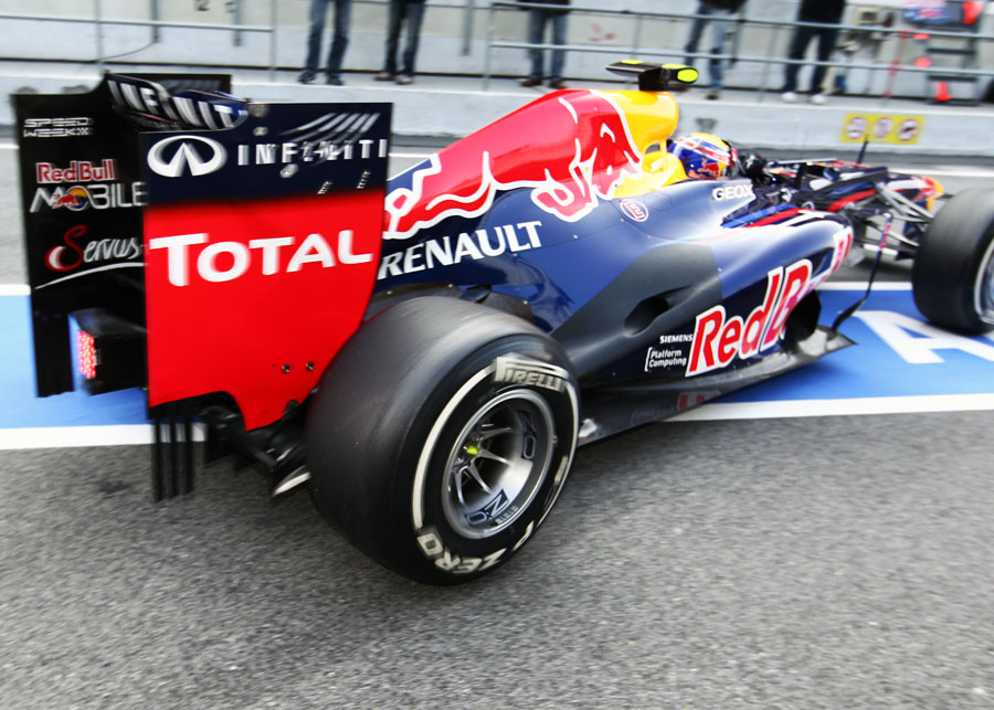 Mark Webber leaves the garage in the heavily-revised Red Bull