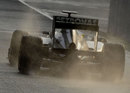 Nico Rosberg leaves the pits on wet tyres