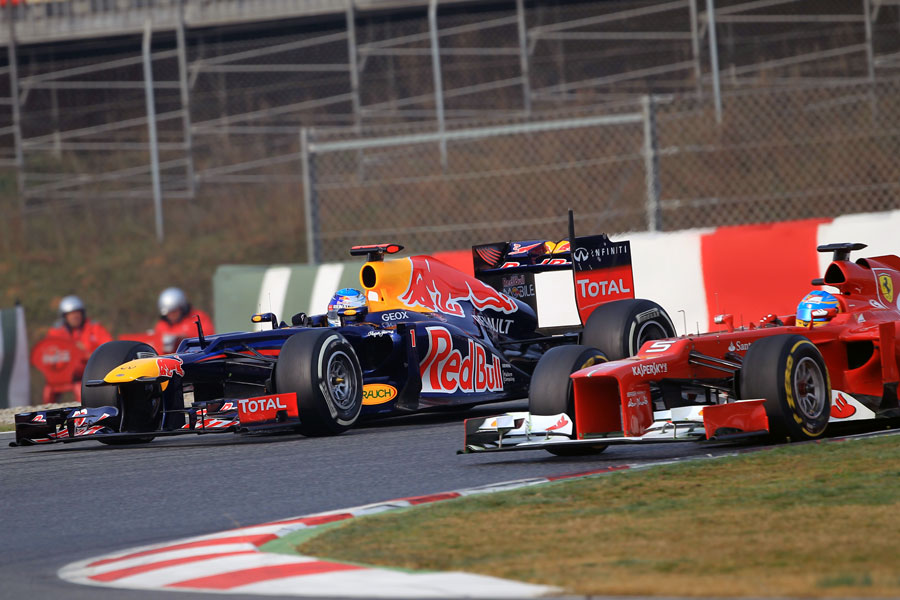 Fernando Alonso goes wheel to wheel with Sebastian Vettel