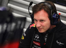 Christian Horner examines the rear of the Red Bull