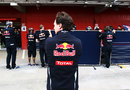 Christian Horner watches on as his mechanics cover up the Red Bull