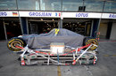 A Lotus chassis outside the team's garages