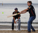 Sebastian Vettel and Mark Webber play cricket on St Kilda Beach