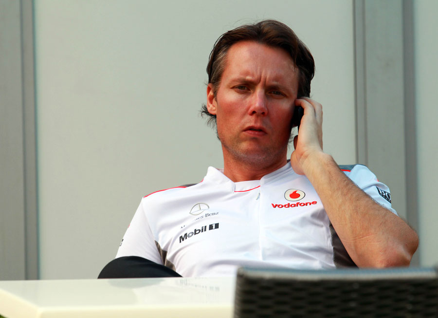 Sam Michael talks on the phone ahead of his first race in an official McLaren capacity