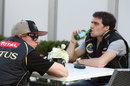 Kimi Raikkonen and Lotus reserve driver Jerome d'Ambrosio share a table in the paddock