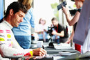 Mark Webber signs autographs for his local fans