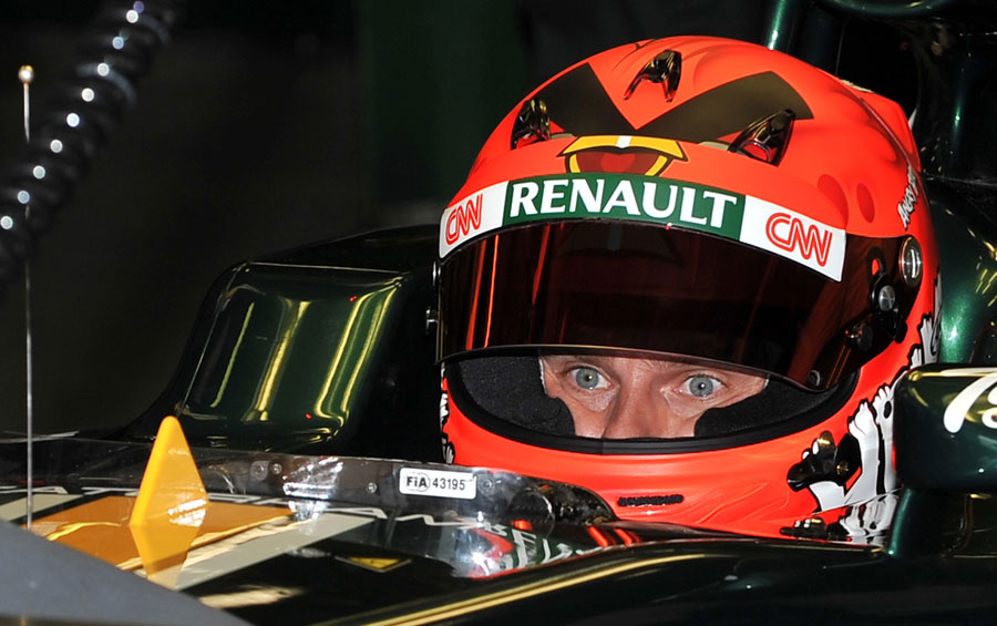 Heikki Kovalainen in the cockpit of his Caterham and wearing a new helmet design inspired by the mobile game Angry Birds