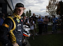 Kimi Raikkonen poses for photos in the paddock on Thursday