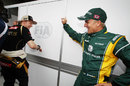 Kimi Raikkonen jokes around with Heikki Kovalainen in the paddock