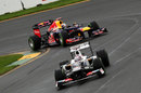 Mark Webber follows Kamui Kobayashi through the opening corners of the lap