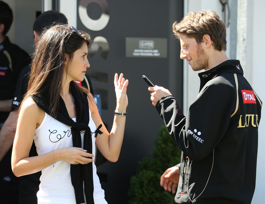 Romain Grosjean in the paddock with his girlfriend and TV presenter Marion Jolles