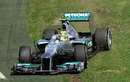 Nico Rosberg slides over the grass at turn one