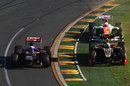 Daniel Ricciardo, minus a front wing on his Toro Rosso, gets passed by Kimi Raikkonen and Paul di Resta on the grass