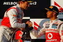 Lewis Hamilton congratulates Jenson Button on winning the first race of the season