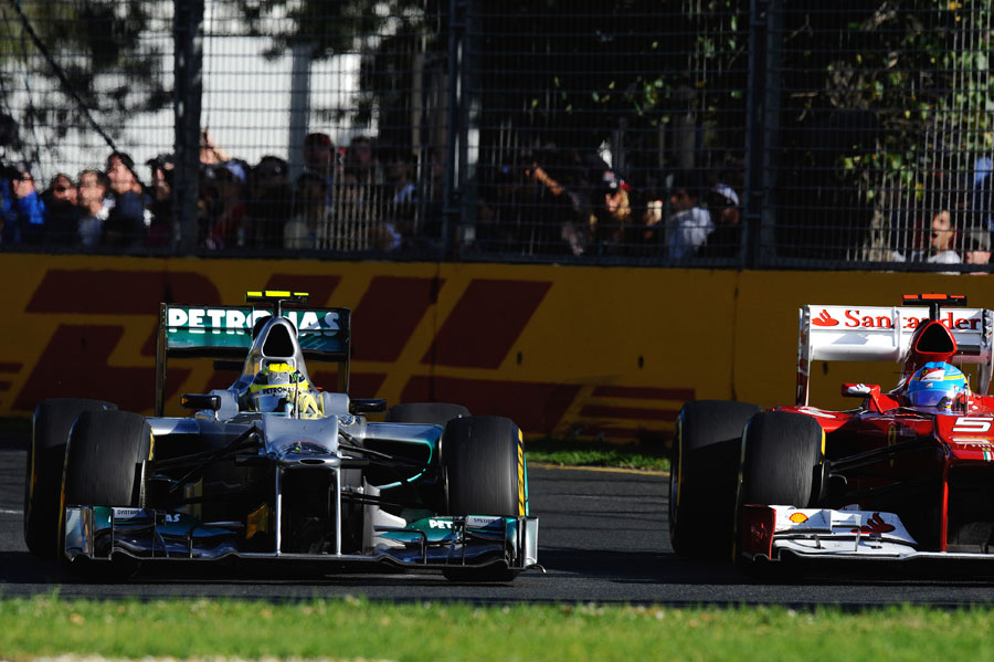 Nico Rosberg holds off Fernando Alonso in to turn three