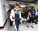 Pastor Maldonado leaves the Williams garage after speaking to his mechanics