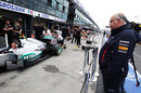 Red Bull's Rob Marshall observes the Mercedes W03 during pit stop drills