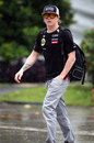 Kimi Raikkonen is unperturbed by the rain in the paddock on Thursday 
