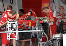 Ferrari mechanics work on Felipe Massa's new chassis