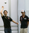 Romain Grosjean and Jean-Eric Vergne play boules in the paddock