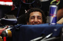 Daniel Ricciardo jokes with his engineers in the Toro Rosso garage