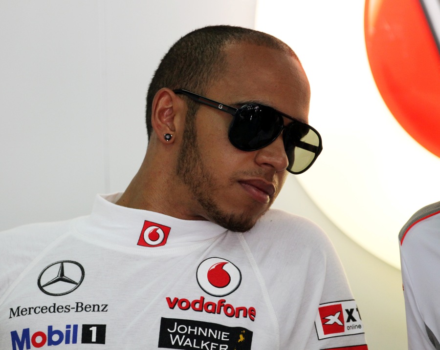 Lewis Hamilton relaxes in the back of the garage