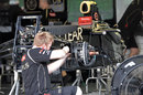 Lotus mechanics work on Kimi Raikkonen's car