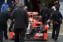 Timo Glock is pushed back into the garage in the Virgin VR-01