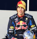 Sebastian Vettel poses for photos with the new Red Bull Racing RB6
