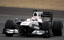 Kamui Kobayashi corners hard in the Sauber