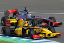 Jenson Button vies with Robert Kubica for track position