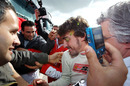 Fernando Alonso gets swamped by media and fans