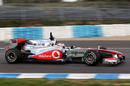 Jenson Button locks a wheel under braking