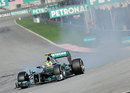 Nico Rosberg locks a tyre under braking for turn one